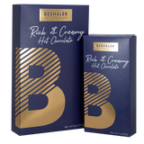 Royal blue 8oz. and 3oz. boxes of rich & creamy hot chocolate with gold foil lettering.