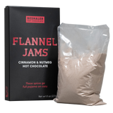 Black 8oz. box of cinnamon & nutmeg hot chocolate with red lettering.