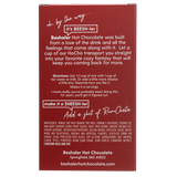 Back of red 8oz. box of cinnamon & nutmeg hot chocolate with mixing directions.