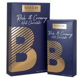 Royal blue 8oz. and 3oz. boxes of rich & creamy hot chocolate with gold foil lettering. 