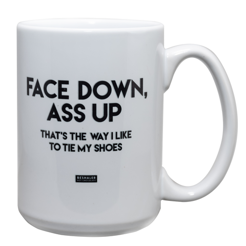 White 15oz. ceramic drinking mug with the saying, "Face down ass up thats the way i like to tie my shoes."